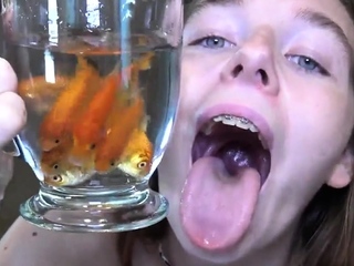 Becky feeding on fish in the shower – Vore Giantess