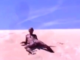 Tanned guy on beach in tiny string thong (temporarily!)