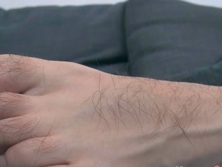 Solo gay twink eats his own cum from his hairy feet
