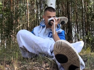 Outdoor gay twink masturbates in the woods